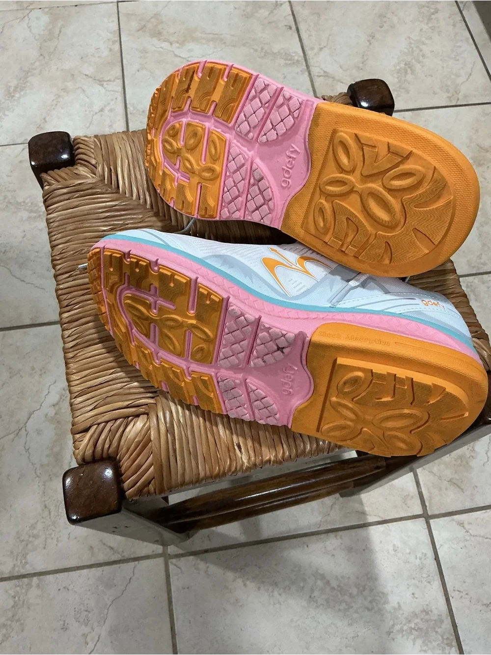 Women’s White Athletic Running Shoe with Pastel Pink, Aqua, and Orange Accents